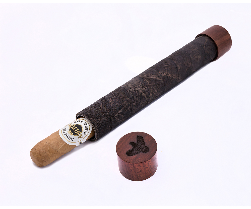 This handmade custom one-piece cigar holder is wrapped in elephant skin and holds up to a 7-inch, 60-ring cigar.  An Earth Magnet at the end cap allows easy removal of the cigar, and the Covey Rise quail silhouette is burned into the walnut wood end cap.  The holder has a lifetime warranty from the maker, Stutzman Hells Canyon Custom Rods