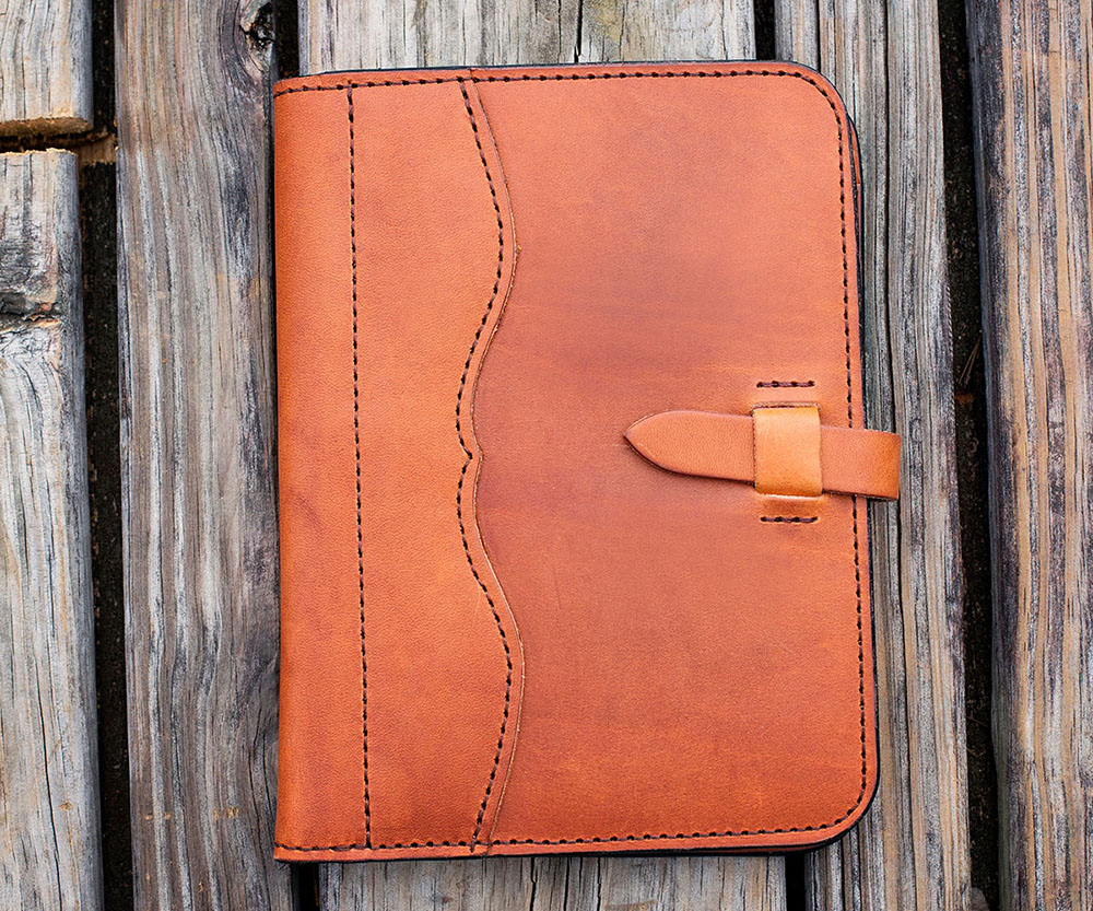The perfect business companion. The attention to detail in this Portfolio is unparalleled: Genuine Hermann Oak Natural Tooling Leather gives this piece the longevity of a saddle, and develops a beautifully rich patina with everyday use, and the pocket features make for great organization. Accompanied by a 3oz. Saddle Tan Deerskin lining, your belongings will be well­ protected. We've included 40 pages of Covey Rise Stationery in each Portfolio. Sometimes the term 